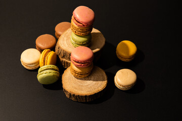 french dessert on wooden board isolated on black background