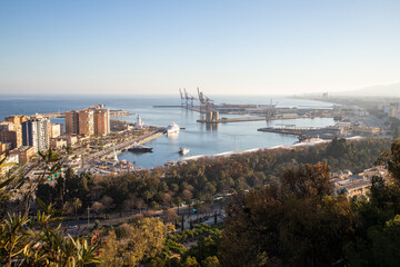 Obraz premium view over Malaga at sunset travel banner