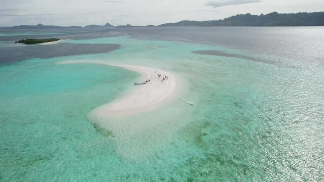 Aerial video on Snake Island Indonesia Aerial view showing boats and tourists enjoying Snake Island