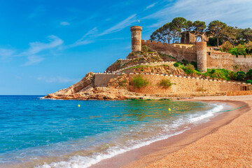 Fototapeta na wymiar Old castle and beach in Tossa de Mar in Catalonia, Spain, Europe