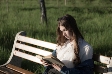 Portrait of a beautiful girl with a book.