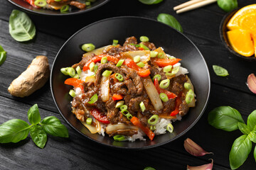 Stir fry Crispy Orange Beef with sweet peppers, onion and rice. Asian food
