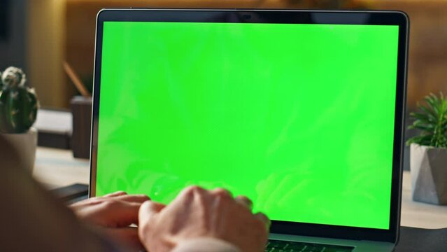 Hands working remote greenscreen laptop at workplace close up. Manager typing