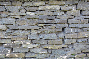 The wall is made of natural stone