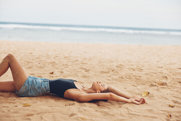Fototapeta na wymiar smile woman sitting outdoor nature travel sand sea beach freedom vacation