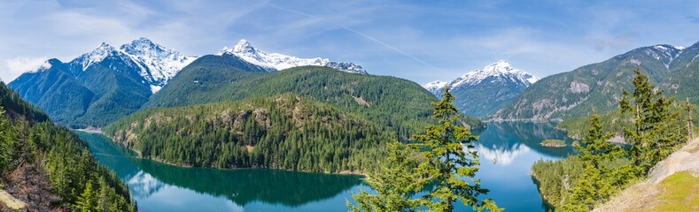 Panorama of Diablo Lake in the Snowcapped North Cascades Mountains and Forest in Whatcom County, Washington, USA