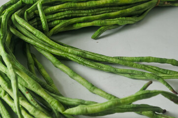 A bunch of raw long beans isolated on a white background