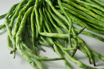 A bunch of raw long beans isolated on a white background