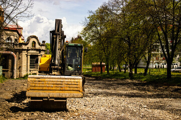 Plakat bulldozer at work, reconstruction of the old road