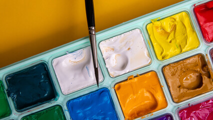 Set of watercolor-gouache paints, brush for painting