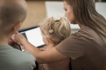 Deaf kid with hearing aid cochlear implant have fun with parents - Hear aid and medicine innovating technology and diversity concept