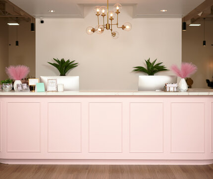 CONROE, TEXAS, USA - APRIL 15th 2023: 5 female managers of a beauty salon are posing for a business portrait in the salon against their company logo. Thel have professional makeup and hair extensions