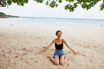 Fototapeta na wymiar hair woman nature vacation beach sand long travel smile sitting sea freedom