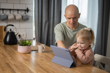 Deaf kid with hearing aid cochlear implant have fun with parents - Hear aid and medicine innovating technology and diversity concept