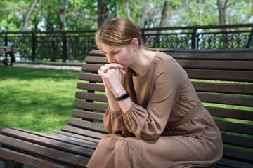 Fototapeta premium Pretty girl sitting on the bench