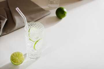 Hard seltzer with ice and lime in glasses on the table