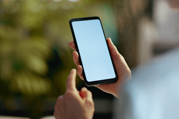 Closeup on modern female with smartphone blank screen
