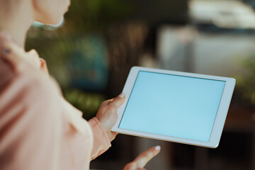 Closeup on modern woman with digital tablet blank screen