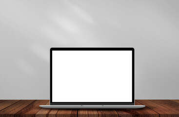 Mockup of Laptop with white screen on wooden table and grey background.