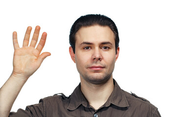 Fototapeta premium Portrait of young man with his hand up on white background
