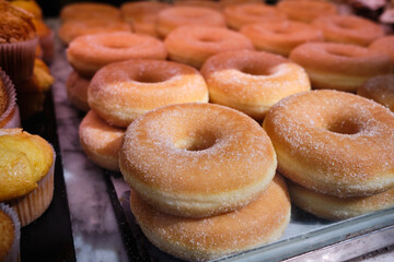Donuts on the window in the coffee shop