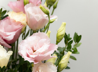 Close-up of eustoma flowers in bouquet on neutral background