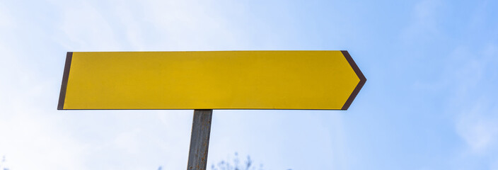 Green road banner with an arrow