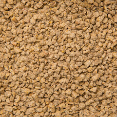Looped Rotation of Compacted Wooden Sawdust Pellets with Brown Stones. - Natural Cat Litter Filler or Organic Fuel. Toilet Particles. Macro