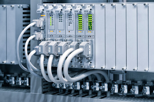 View of communication port module on PLC unit in control box of automation machine