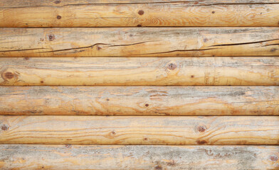Wooden wall assembled of beams or logs. Natural building concept. Brown background nature idea