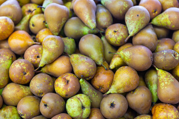 Box with organic pears displayed for sale in supermarket