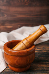 Mortar and pestle on wooden background