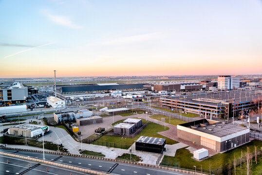 Amsterdam, Netherlands - March 28, 2023: The terminal, parking and runway at Schiphol airport in Amsterdam
