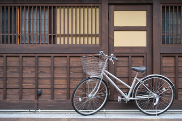 Fototapeta na wymiar Bicycle park outside a Japanese wooden house in Takayama, Hida, Gifu, Japan.