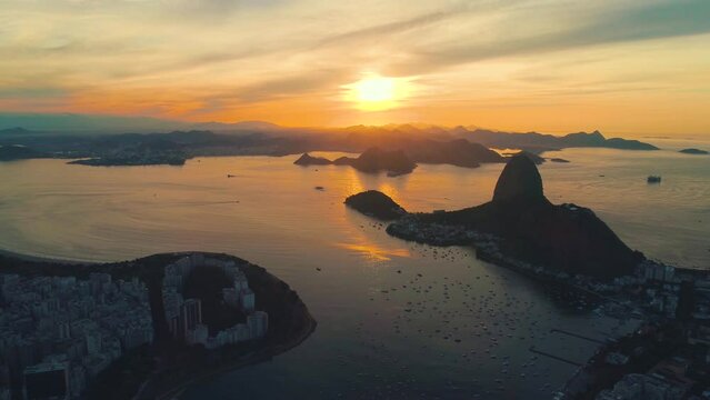 RIO DE JANEIRO, BRASIL - MAY, 2023: Drone aerial view of of Botafogo beach and district and Guanabara Bay. Modern and historical buildings on the shore on background at sunny day from above.