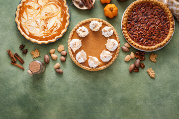 Traditional Thanksgiving pies with pumpkin pie in the middle