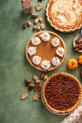 Traditional Thanksgiving pies with pumpkin pie in the middle