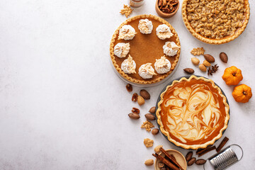 Traditional Thanksgiving pies with pumpkin pie in the middle © fahrwasser