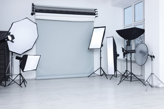 Interior Of Modern Photo Studio With Professional Lighting Equipment