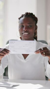Holding Paycheck Or Payroll Check Or Insurance Cheque