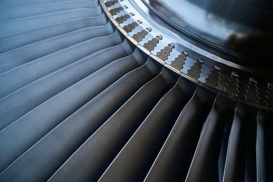 The rotor blades of a modern turbine, a close-up shot of the roots of long blades