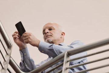 Senior uses smartphone to take advantage of those who do not