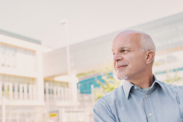 man looks wryly to his right toward the copyspace