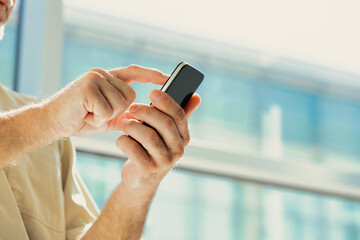 Senior uses smartphone to take advantage of those who do not