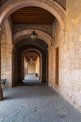Fototapeta na wymiar arched walkway off courtyard of michoacan state government palace morelia mexico