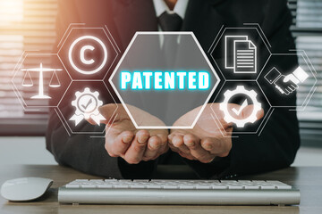 Patent concept, Person hand holding patented icon on virtual screen, Patent Copyright Law Business...
