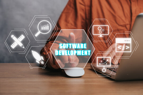 Software development concept, Person working on laptop computer with software development icon on virtual screen.