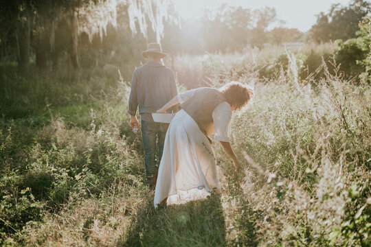 Farmers Foraging In Field