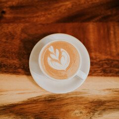 cup of coffee on wooden table