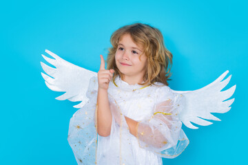 Valentines day banner. Cute child with angel wings. Studio portrait of angel child on studio color isolated background with copy space.